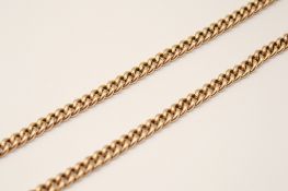 A 9ct gold Albert chain. Each link with partial hallmarks and hallmarked to both t-bars.