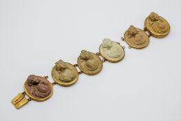 A Victorian Grand Tour 'lava stone' cameo panel bracelet.