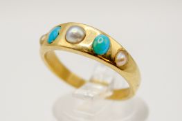 A yellow metal, turquoise and half cultured pearl ring.