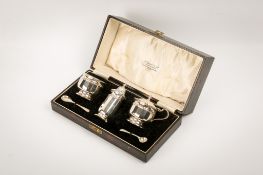 A boxed silver cruet set.
