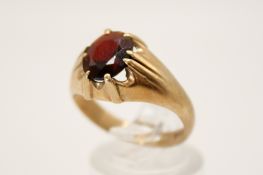 A 9ct gold and garnet ring.