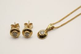 A 9ct gold diamond necklace and earring set. The small diamonds circa 2.