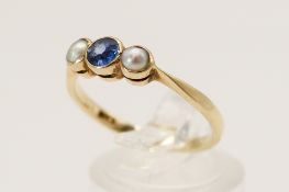 A 9ct gold, pearl and blue stone ring. The central stone of circa 3.