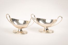 A pair of late 19th century twin-handled silver dishes.