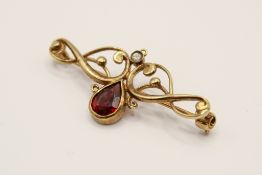 A 9ct gold scroll brooch.