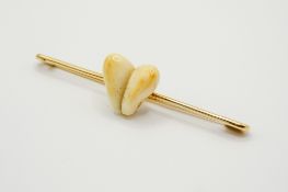 A 14ct gold stag tooth bar brooch.