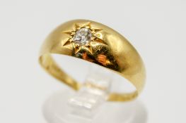 An 18ct gold and diamond ring.
