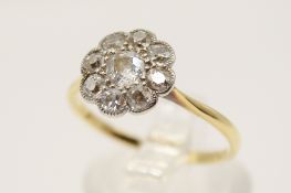 An early 20th century 18ct gold (tested) diamond cluster ring.