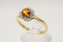 An 18ct gold, diamond and citrine dress ring.