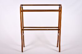 An Edwardian mahogany bathroom towel rail.