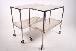 A pair of industrial stainless steel trolleys. Having two shelves, mounted on wheels, H88.