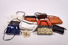 A large collection of vintage handbags.