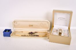 A quantity of costume jewellery and a Rotary lady's wristwatch boxed.