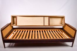 A mid-century teak Scandinavian style sofa bed, unbranded.