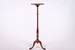 A 20th century mahogany plant stand.