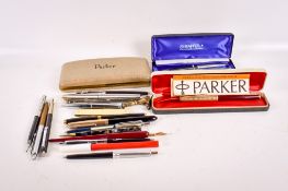 A collection of fountain pens, ballpoint pens and propelling pencils.