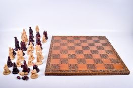 A vintage Napoleon and Josephine resin chess set (AF).