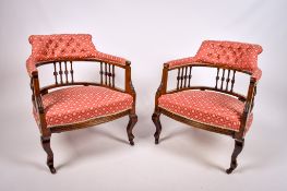 A pair of late Victorian mahogany tub-shape armchairs.