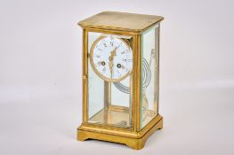 A French four glass brass mantel clock.