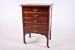An Edwardian mahogany music cabinet chest of drawers.