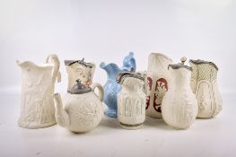 Seven 19th Century English pottery pitchers and a teapot.