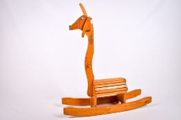 A novelty wooden rocking animal.