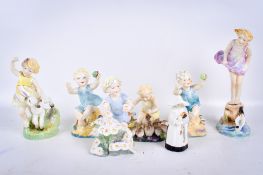 A collection of seven Royal Worcester porcelain figures, mostly Doughty children.
