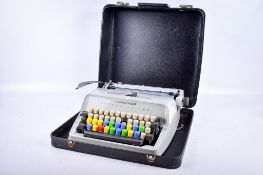 A Scheidegger Typomatic TMS portable typewriter.