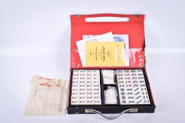 A set of the Chinese 'game of the four winds', Mah-jong, cased.