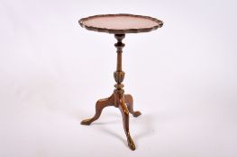 A 20th century mahogany wine table.