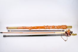 Four walking sticks of various designs. One having a gold painted dog handle, etc.