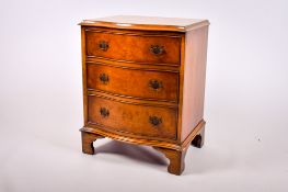 A Bevan Funnell reproduction walnut chest of drawers.