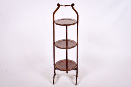 An early 20th century mahogany folding cake stand.
