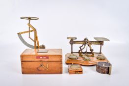 A group of postage letter scales, weights and measuring instruments.