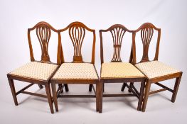 A matched set of four antique Hepplewhite style mahogany dining chairs.