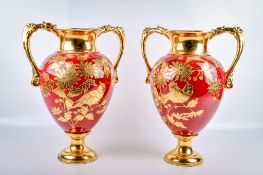 A pair of 20th century aesthetic movement twin-handled vases.