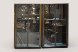 A pair of Mid-century Ercol stained elm display cabinets.