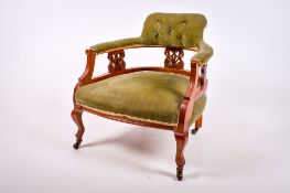 A late Victorian mahogany upholstered tub chair.