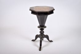 A Victorian ebonized mahogany trumpet shaped sewing table with inlaid chess top.