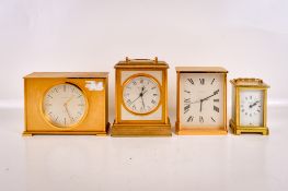 Four mid-century mantel clocks. Including two Garrard quartz no. 2194 and 2202, etc.