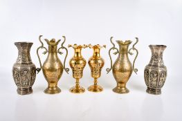 Three pairs of brass and cast metal vases.