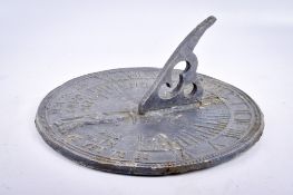 A lead sundial, 'Grow Old Along With Me The Best Is Yet To Be'.