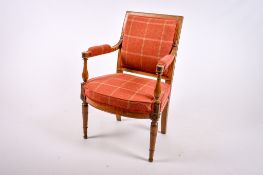 A 20th century wooden framed elbow chair.