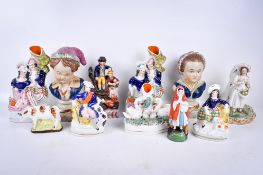 A collection of Staffordshire flat back pottery figures. Including a pair of busts, etc.