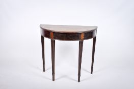 A small Georgian ebonized mahogany demi-lune console side table.