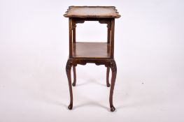 A 20th century mahogany side table.