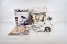 A Kenwood Chef KM300 food processor with attachments.