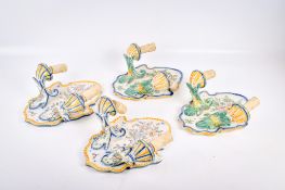 Two pairs of faience Portuguese ceramic wall sconces.