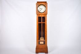 A 1920s Art Deco oak long cased clock. The white painted dial with Arabic numerals, marked 'H.A.C.