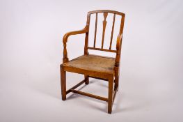 An early 20th century oak carver chair.
